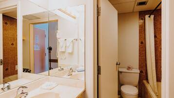 Room, 2 Queen Beds | Bathroom | Combined shower/tub, hair dryer, towels, soap