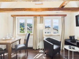 Superior Studio, City View | Living area | TV