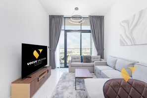 Luxury Apartment, Balcony, City View | Living area | 65-inch Smart TV with cable channels - Vogue | The Gate near Yas Island | Ferrari World (Abu Dhabi)
