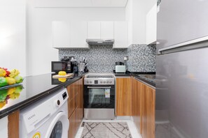 Luxury Apartment, Balcony, City View | Private kitchen - Vogue | The Gate near Yas Island | Ferrari World (Abu Dhabi)