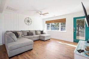 TV, fireplace, DVD player, video library - Up On The Roof: Comfy Bungalow in Walking Distance to Beach (Oak Island)