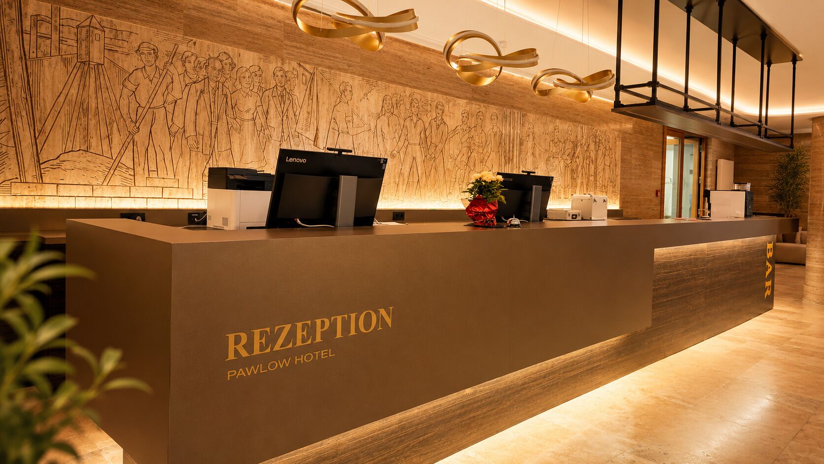 A reception desk with a wooden backdrop and a modern design.