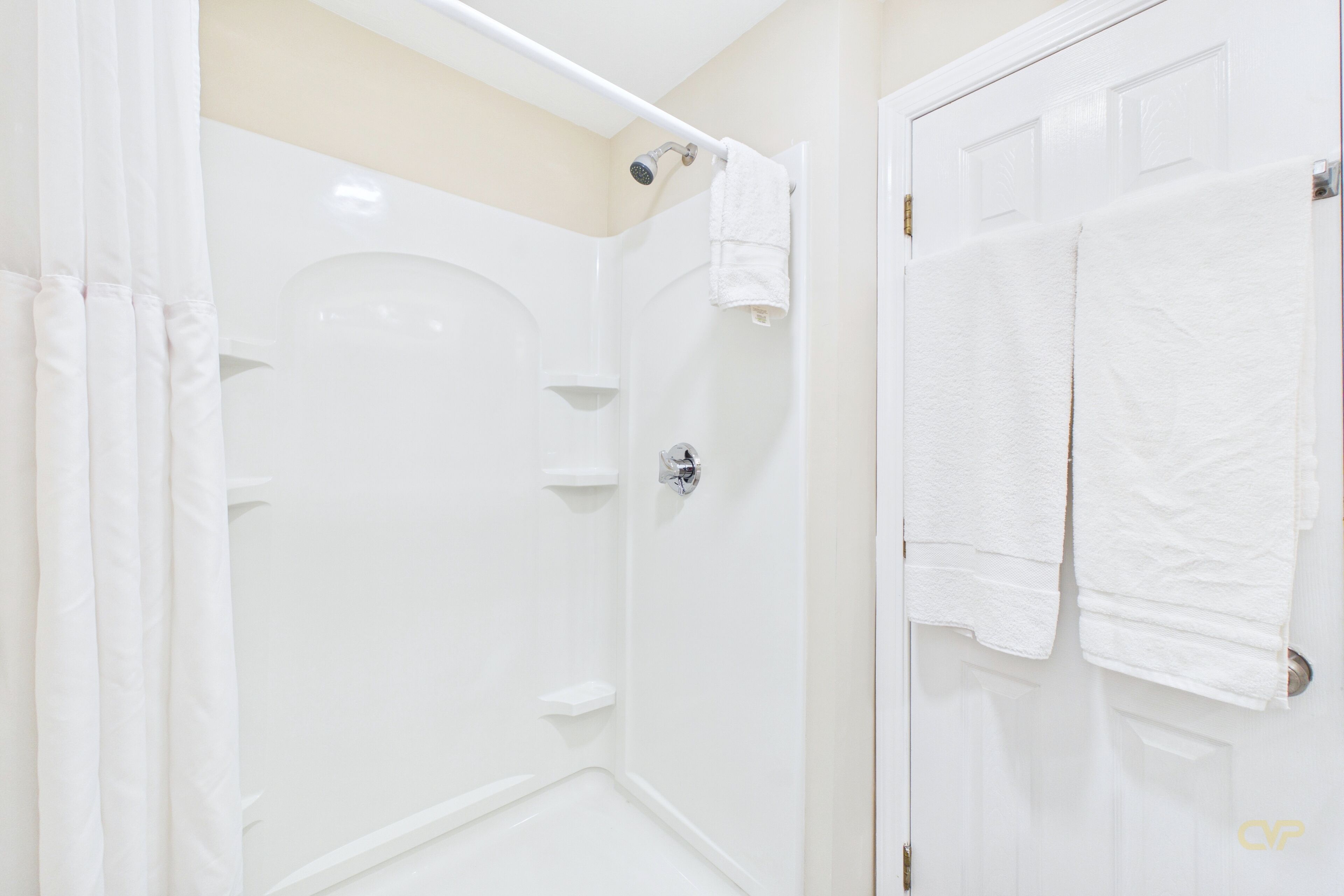 Separate tub and shower, towels, soap, shampoo