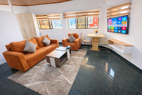 Apartamento superior, 1 habitación | Zona de estar