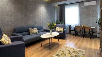 Luxury Apartment | Living area | TV, printers