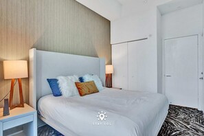 Bright, inviting bedroom designed for restful nights - King bed  - Cozy Apartment -Balcony & Beachfront Resort (Hollywood)