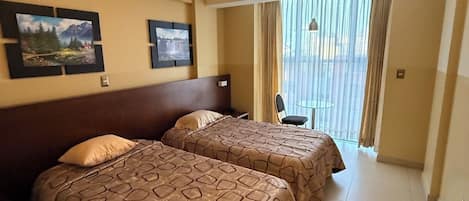Family Twin Room, Private Bathroom, City View | Laptop workspace, free WiFi