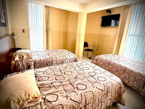 Family Triple Room, Multiple Beds, Private Bathroom, City View | Laptop workspace, free WiFi - Hotel Reyna (La Victoria)