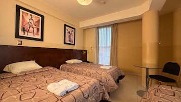 Family Triple Room, Multiple Beds, Private Bathroom, City View | Laptop workspace, free WiFi