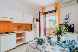Fridge, microwave, cookware/dishes/utensils