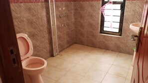 Deluxe Single Room | Bathroom | Slippers, towels, soap, toilet paper - Destination Code 254 Nyeri (Nyeri Hill)