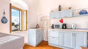 Fridge, microwave, cookware/dishes/utensils