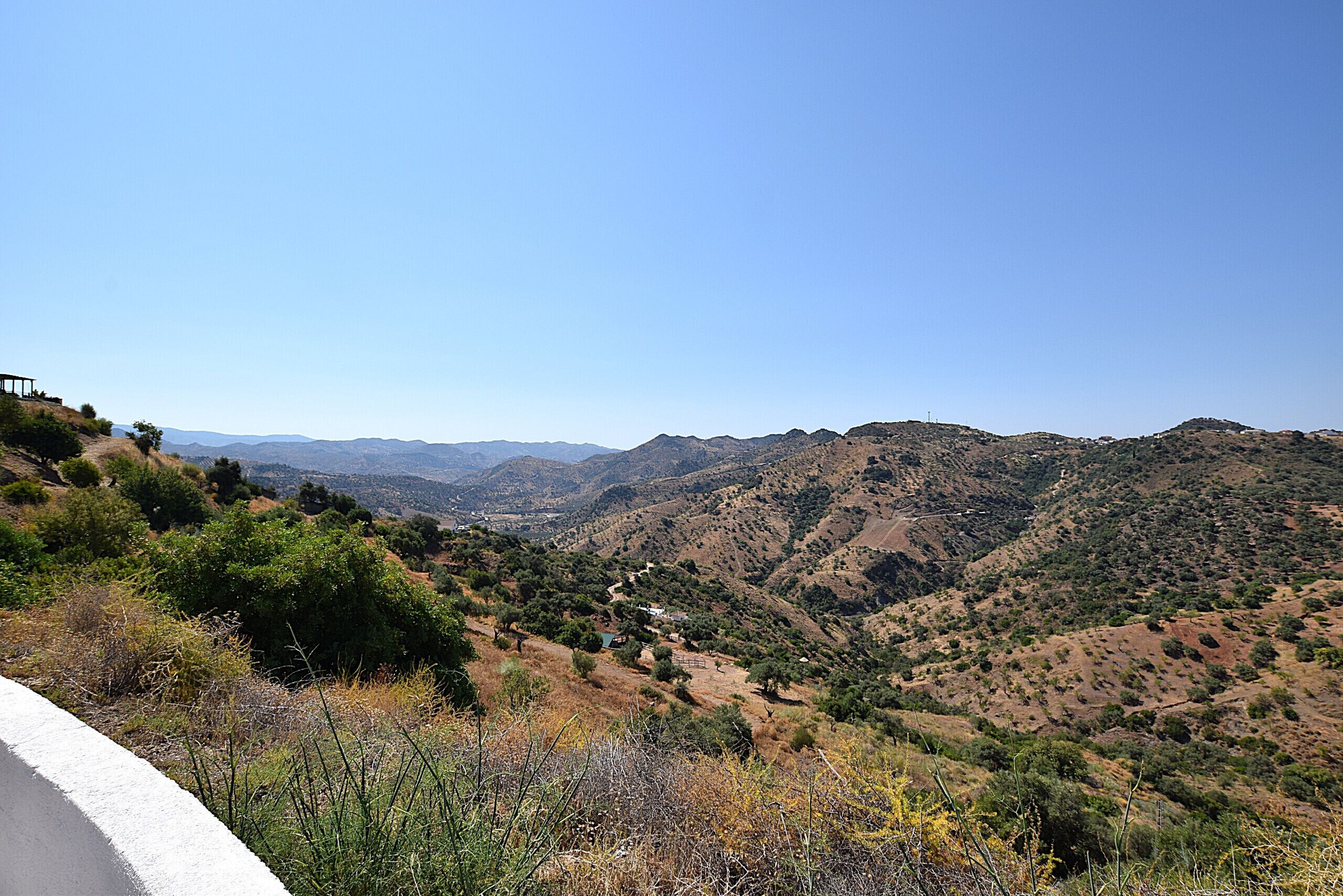 A hilly landscape with a clear sky.