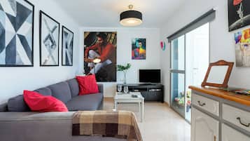 Apartamento, vista para a cidade | Área de estar