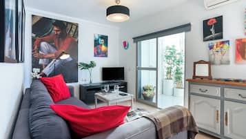 Apartamento, vista para a cidade | Área de estar