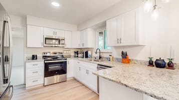 House, Multiple Beds, Patio, Garden View (Cozy Palm Bay Get Away) | Private kitchen | Dining tables