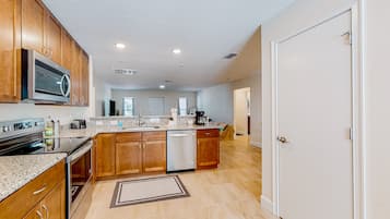 House, Multiple Beds, Patio, Garden View (Tropical Haven Retreat) | Private kitchen | Dining tables