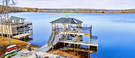 Aerial View - The two-tiered covered dock stretches into Lake Anna, with the estate rising up the hillside behind it.