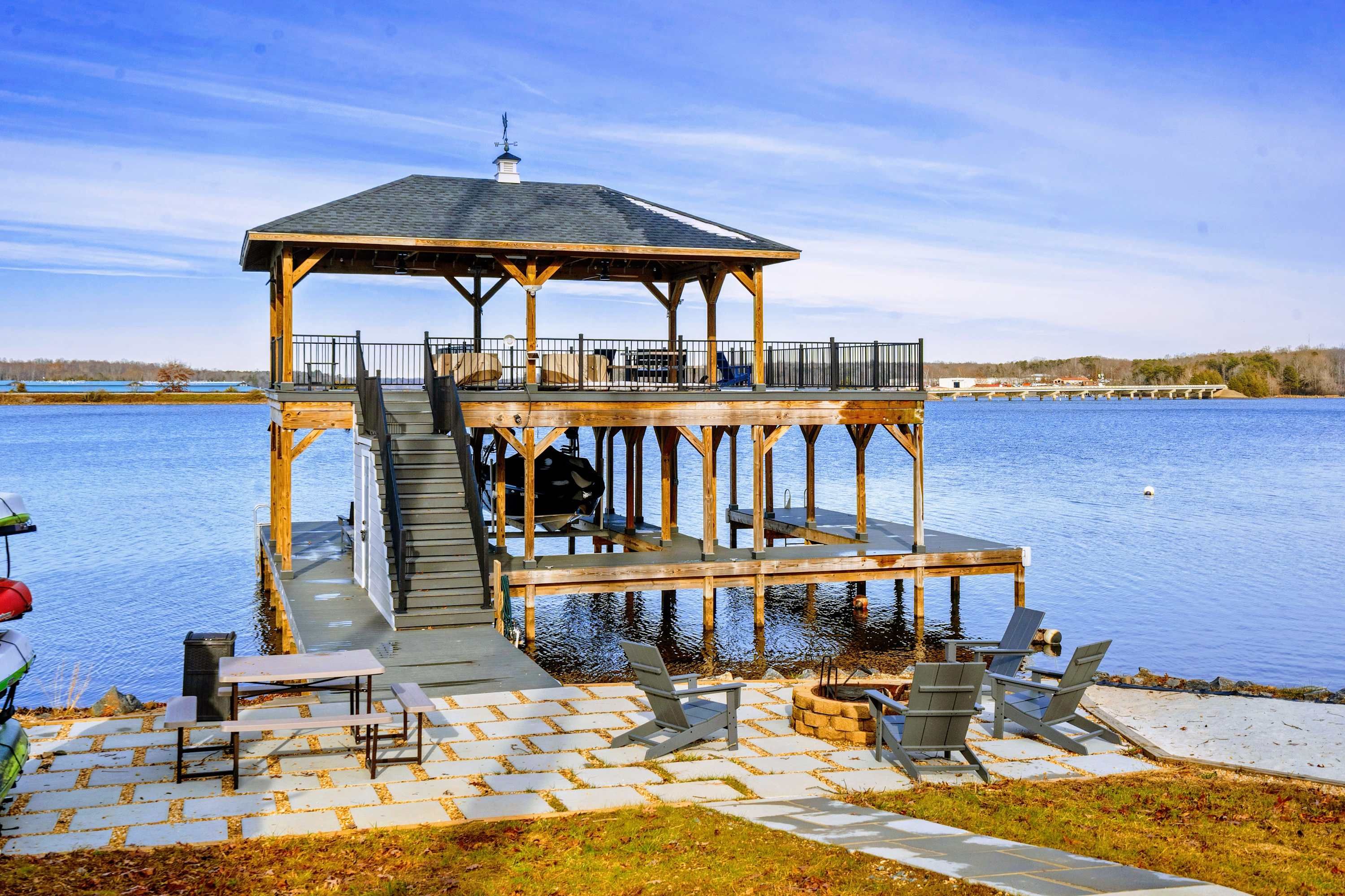 Lakeside View - The home's tiered design gives both floors their own outdoor living space, all oriented toward the water.