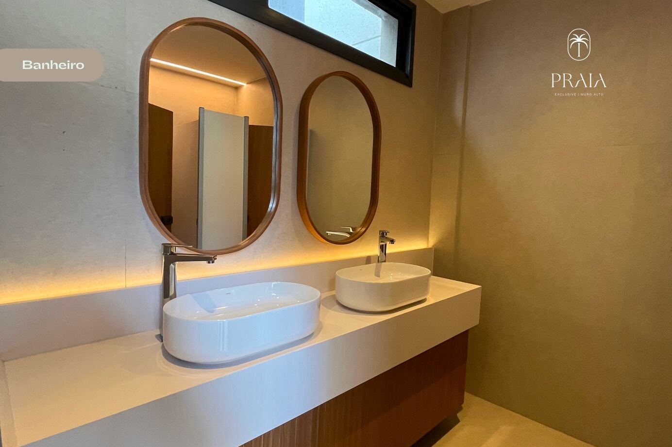A bathroom with two sinks, each with a round mirror above. The wall is plain with a window above the mirrors.