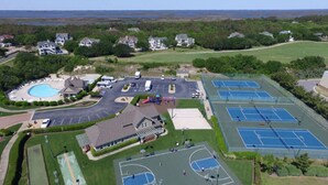 An aerial view of a residential area with a swimming pool, tennis courts, and a basketball court. - Currituck Club Resort Usage-NOT A RENTAL OF LIVING SPACE: Please read descript (Corolla)