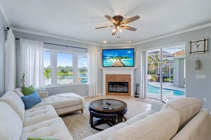 TV, fireplace - Palm Harbor Retreat with Pool, Firepit, Pool Table & Pet-Friendly (Palm Harbor)