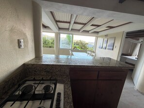 Family Quadruple Room, Mountain View | Private kitchen | Full-sized fridge, stovetop, cookware/dishes/utensils