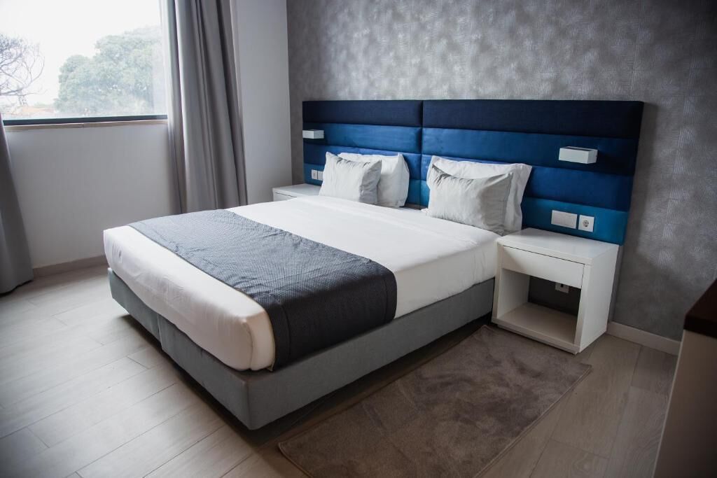 Deluxe Double Room, Pool View | In-room safe, iron/ironing board, free WiFi