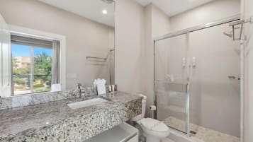 Shower, hair dryer, towels, shampoo