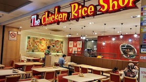 A restaurant interior with multiple tables and booths, a visible menu board, and a 'No Smoking' sign. - The Hotel Apartment At Times Square (Kuala Lumpur)