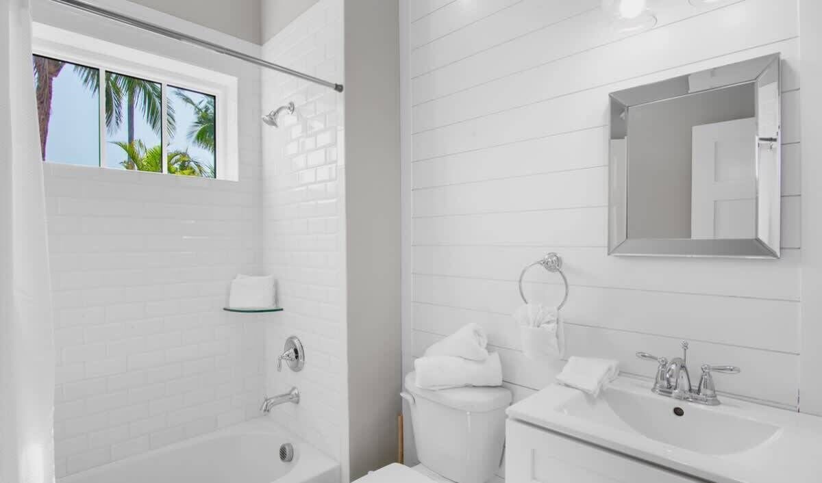 Shower, hair dryer, towels, shampoo