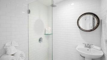 Shower, hair dryer, towels, shampoo
