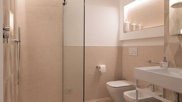 Deluxe Double or Twin Room, Balcony, Garden View | Bathroom | Shower, hair dryer, towels, soap