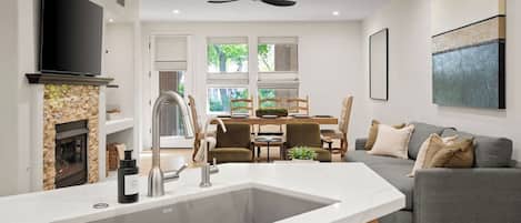 Smart TV, fireplace, books, printers