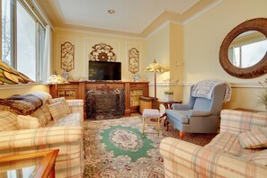 TV, fireplace, books