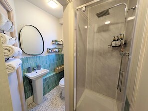 Shower, hair dryer, towels, soap