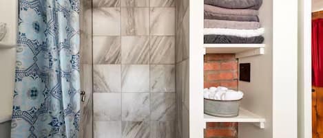 Shower, hair dryer, towels, soap