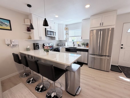 Fridge, microwave, oven, stovetop. Modern Private 2BR Guest House. 10-Min Drive to Downtown Denver. W&D+Parking
