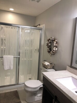 Shower, hair dryer, towels, soap