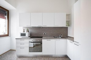 Apartamento, vista para a cidade | Cozinha privada