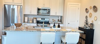 Executive furnished 4BR/4BA townhouse for 30+ day stays with 2-car garage