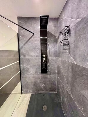 Shower, hair dryer, towels, soap