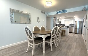A modern kitchen with white cabinets, stainless steel appliances, and a central island. - Gateway Villas #496 "Island Oasis" 2 Bedroom Beachfront (Fort Myers Beach)