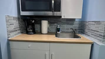 Fridge, microwave, stovetop, coffee/tea maker