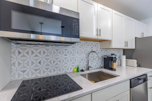 Fridge, microwave, stovetop, coffee/tea maker - Monon Lofts Luxury Garden Suite (Indianapolis)