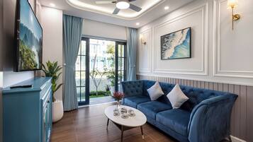 Premier Villa | Living area | 45-inch flat-screen TV with digital channels