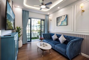 Premier Villa | Living area | 45-inch flat-screen TV with digital channels