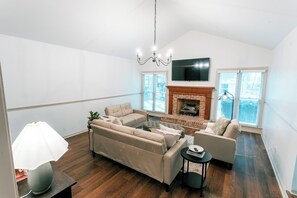TV, fireplace - Raleigh Risque’ Room - Couples’ Retreat & Playroom (Raleigh)