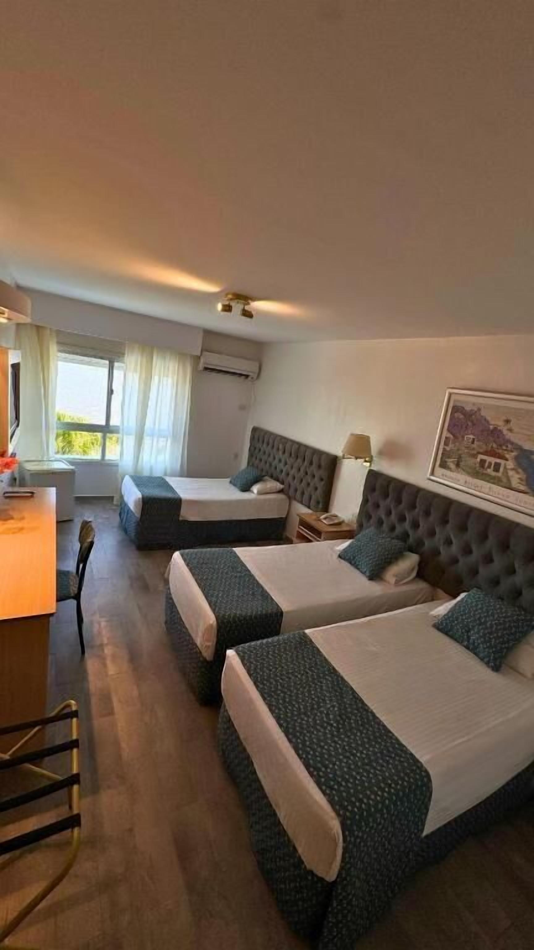 Standard Triple Room, Lake View | In-room safe, desk, free WiFi