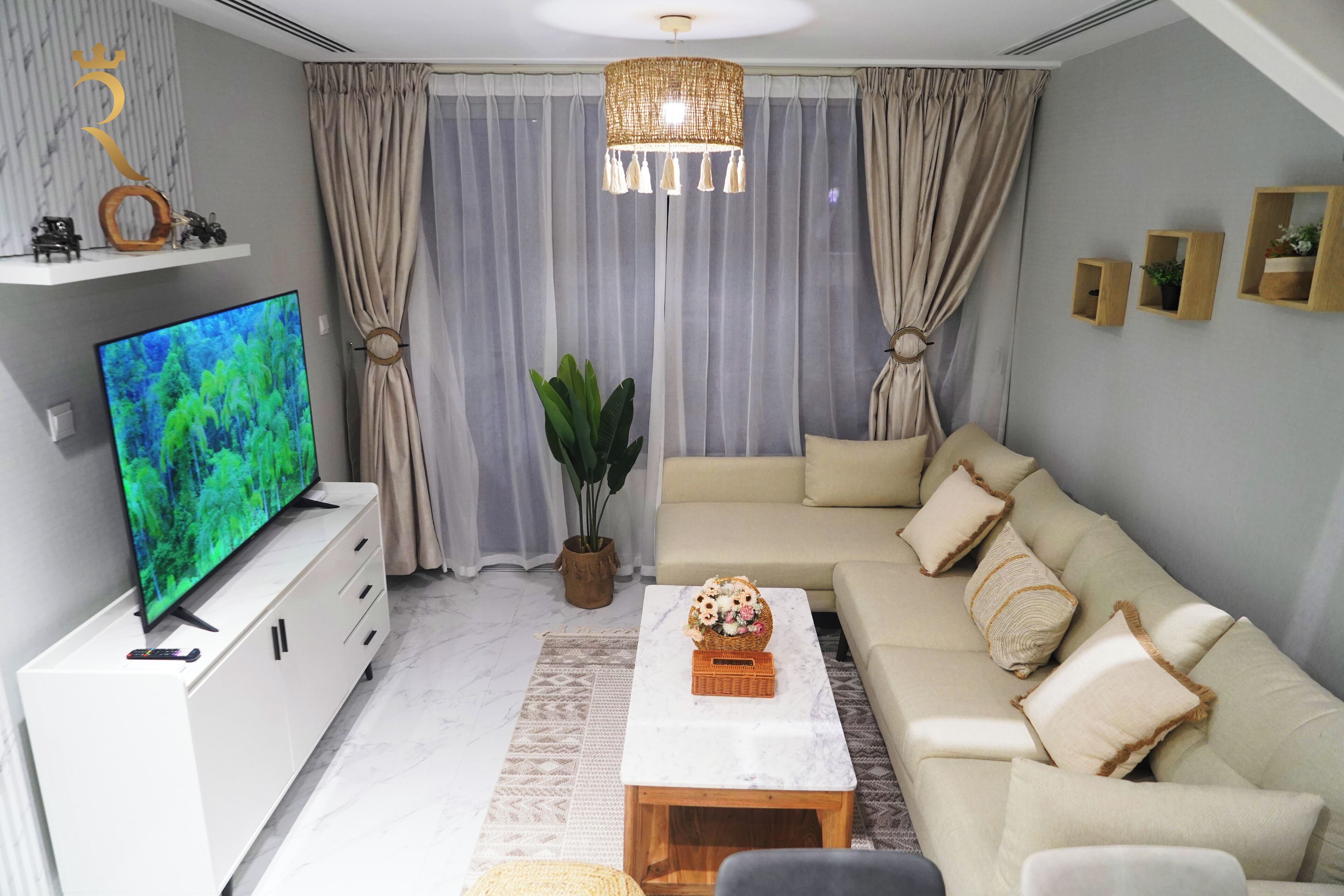 Apartment (831) | Living area | 58-inch flat-screen TV with cable channels